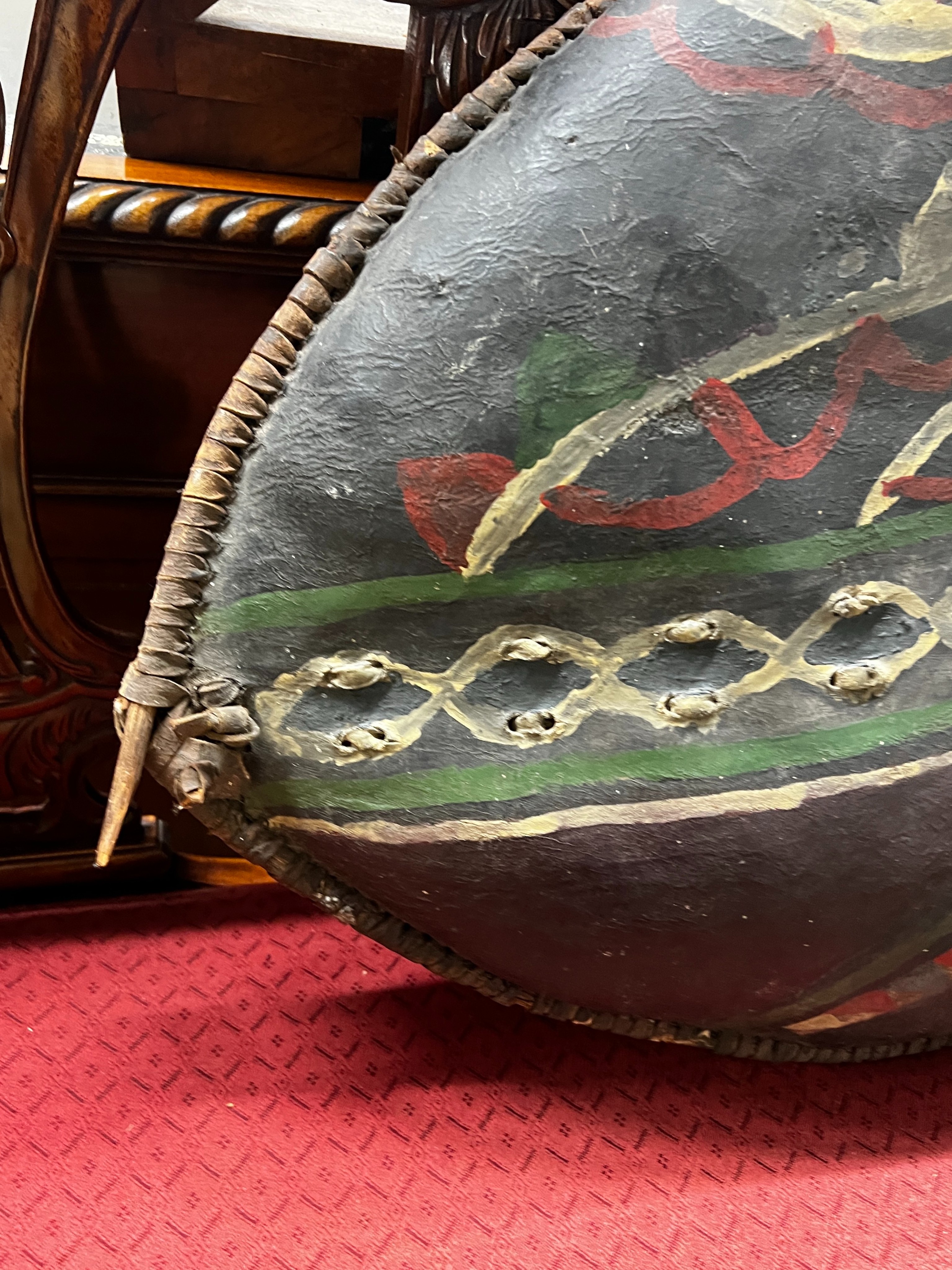 An African painted leather tribal shield, height 102cm